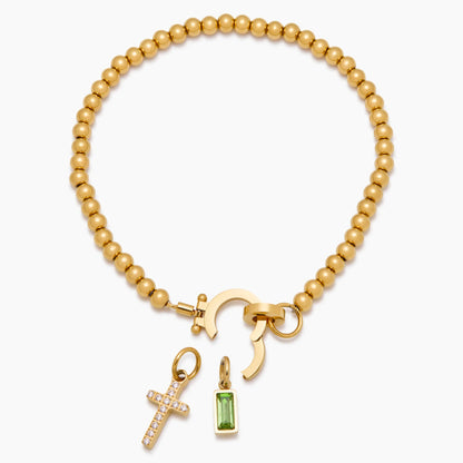 Pulsera con dije de cruz y piedra natal de cuentas
